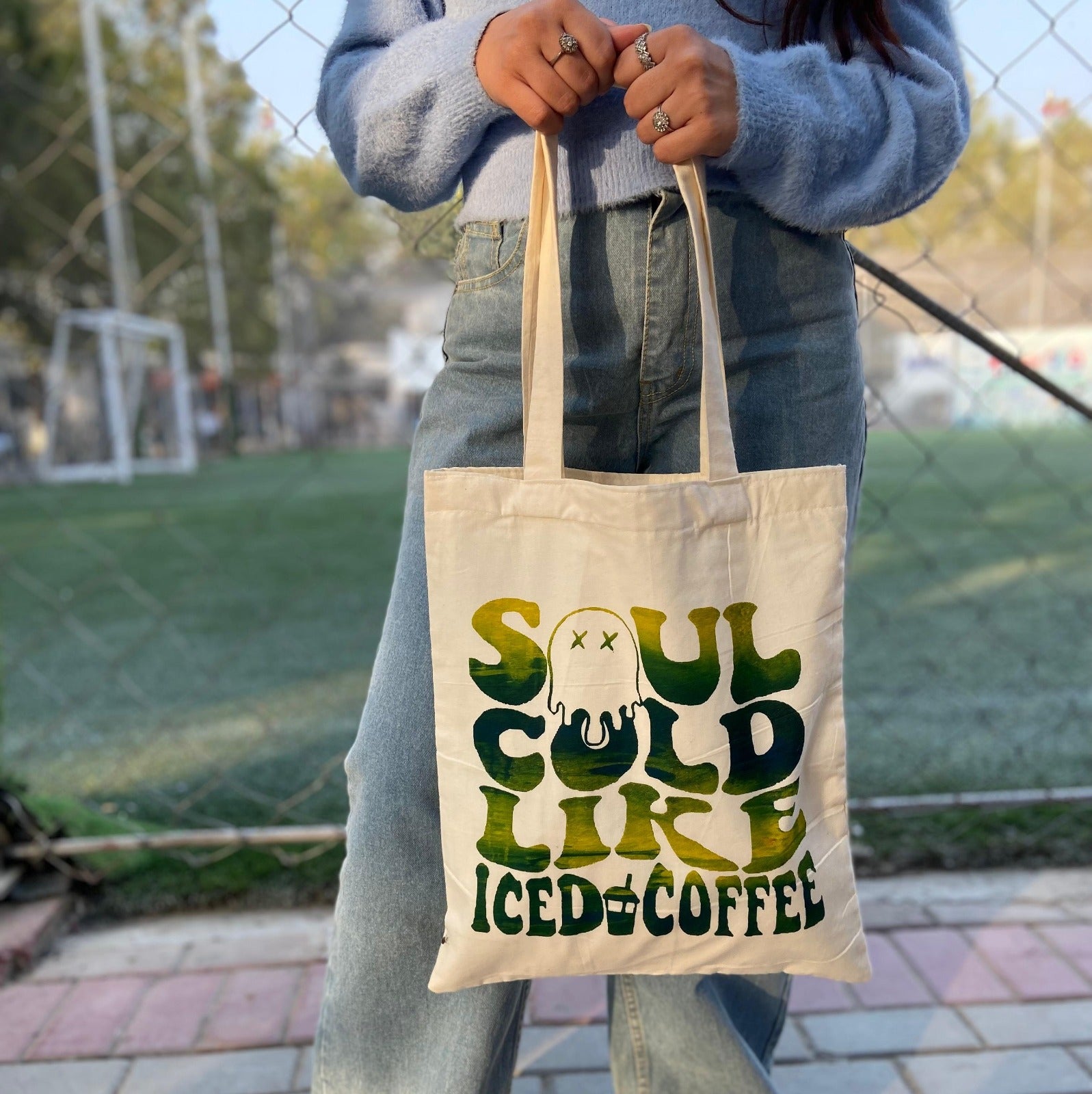 Soul Cold Like Iced Coffee tote in green, lifestyle shot