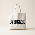 Oversized Mark Tote in white canvas with large OVERSIZED wordmark