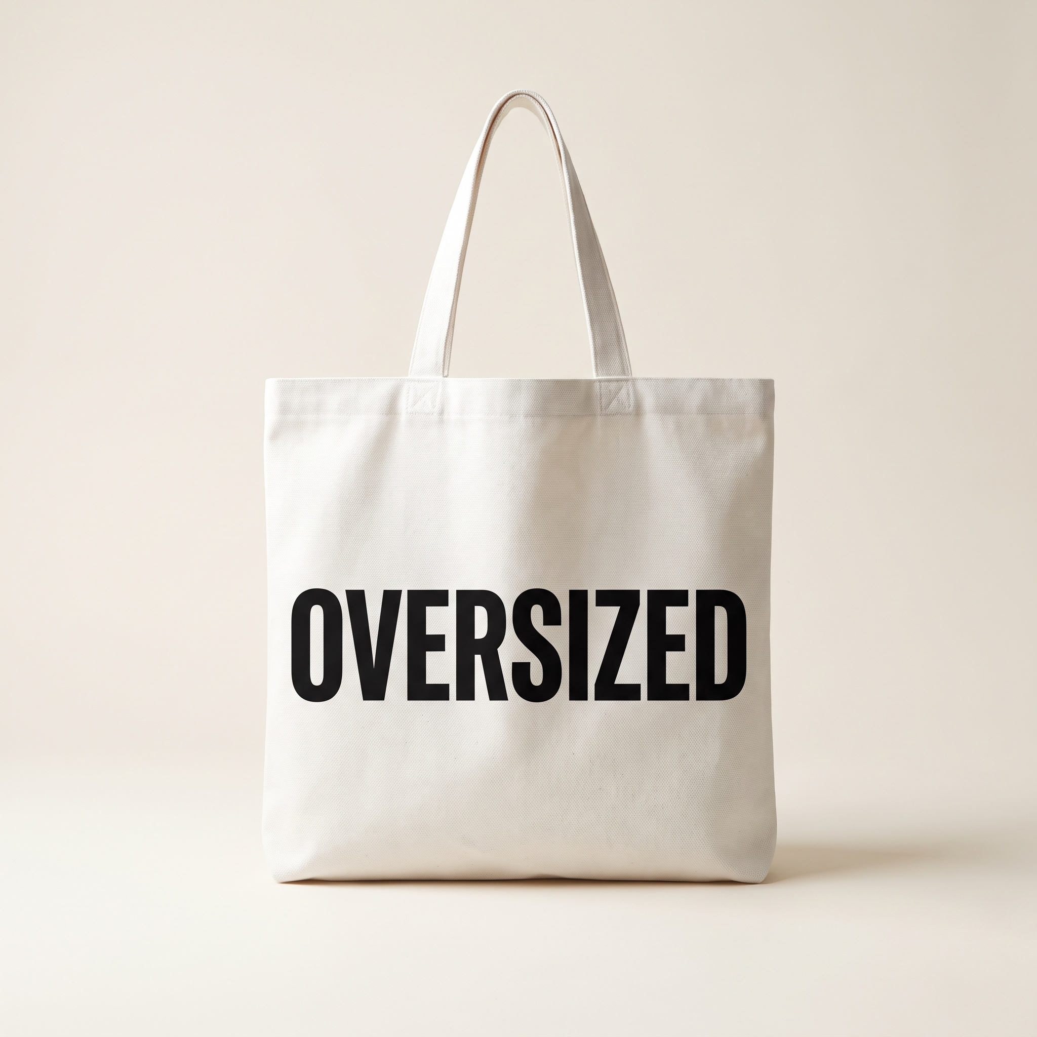 Oversized Mark Tote in white canvas with large OVERSIZED wordmark