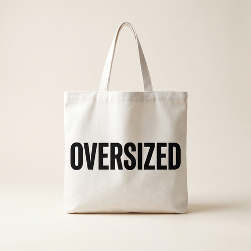 Oversized Mark Tote in white canvas with large OVERSIZED wordmark