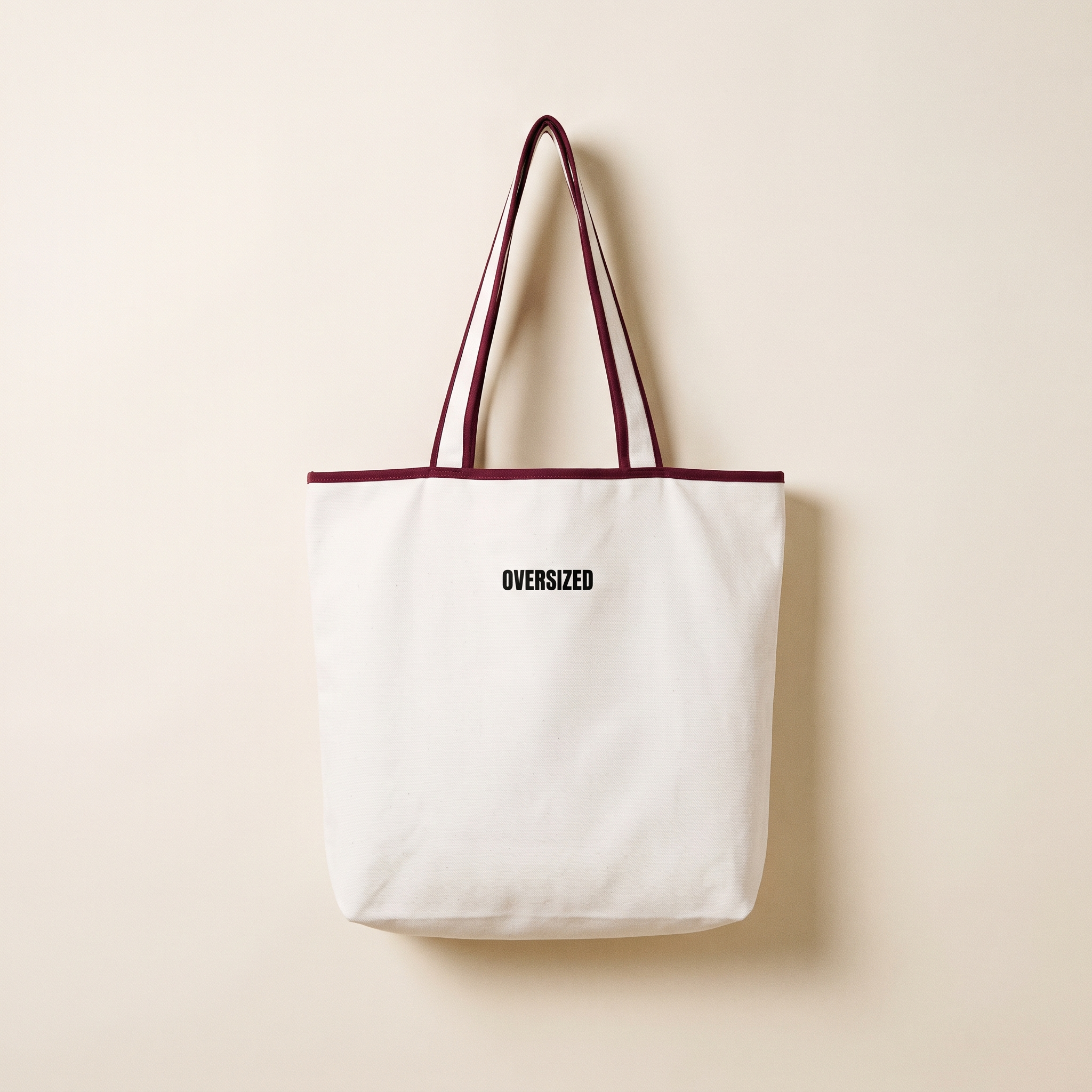 Trim Tote in white canvas with burgundy trim and OVERSIZED wordmark